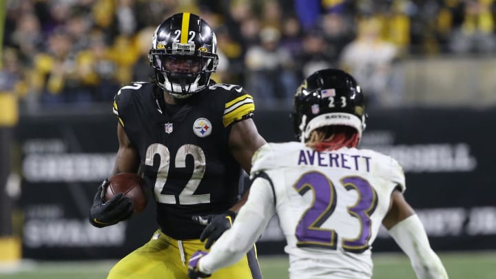 Dec 5, 2021; Pittsburgh, Pennsylvania, USA; Pittsburgh Steelers running back Najee Harris (22) carries the ball against Baltimore Ravens cornerback Anthony Averett (23) during the fourth quarter at Heinz Field. Pittsburgh won 20-19. Mandatory Credit: Charles LeClaire-USA TODAY Sports