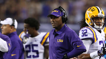 Aug 31, 2013; Arlington, TX, USA; LSU Tigers defensive backs coach Corey Raymond on the sidelines during the game against the Texas Christian Horned Frogs at AT&T Stadium. Mandatory Credit: Matthew Emmons-Imagn Images