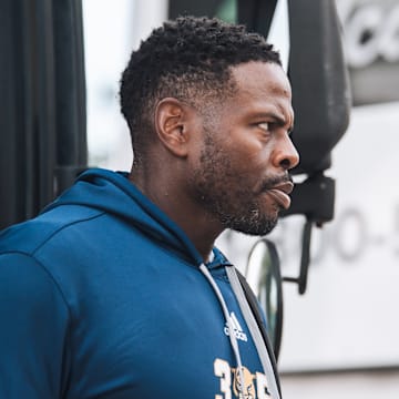 Kenechi Udeze walking out of the bus for Panther Walk