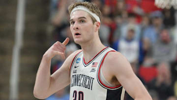 Mar 21, 2025; Raleigh, NC, USA;  Connecticut Huskies forward Liam McNeeley (30) reacts during the first half against the Oklahoma Sooners at Lenovo Center. Mandatory Credit: Zachary Taft-Imagn Images