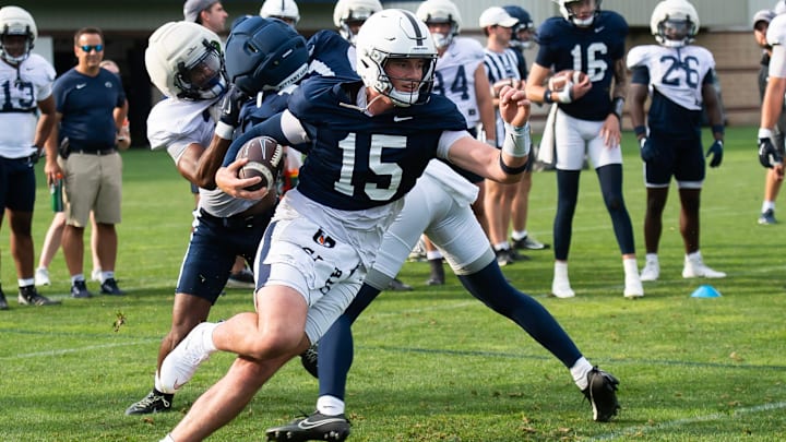 Penn State quarterback Drew Allar (15) runs with the ball during practice outside Holuba Hall on Saturday, August 2, 2025, in State College