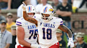 Sep 6, 2025; Columbia, Missouri, USA; Kansas Jayhawks tight end DeShawn Hanika (18) celebrates with offensive lineman Antonio Wilson (76) after scoring a touchdown during the second half against the Missouri Tigers at Faurot Field at Memorial Stadium. Mandatory Credit: Jay Biggerstaff-Imagn Images