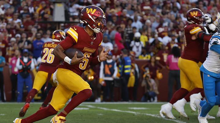 Oct 20, 2024; Landover, Maryland, USA; Washington Commanders quarterback Jayden Daniels (5) runs with the ball against the Carolina Panthers during the first quarter at Northwest Stadium. Mandatory Credit: Geoff Burke-Imagn Images