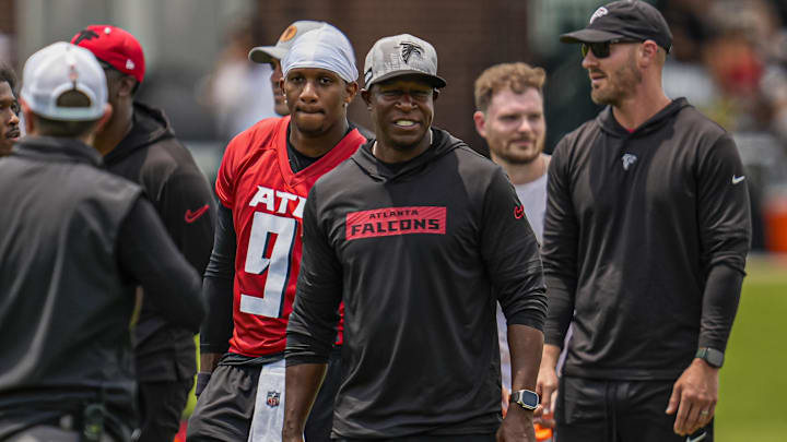 Jun 11, 2025; Atlanta, GA, USA; Atlanta Falcons quarterback Michael Penix Jr. (9) and head coach Raheem Morris on the field during Minicamp at Children's Healthcare of Atlanta Training Ground. Mandatory Credit: Dale Zanine-Imagn Images