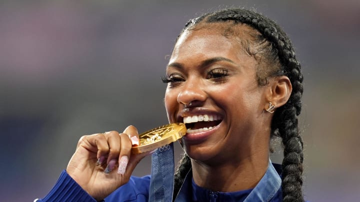 Aug 10, 2024; Paris Saint-Denis, France; Gold medalist Masai Russell (USA) during the medal ceremony for the women's 100m hurdles during the Paris 2024 Olympic Summer Games at Stade de France. Mandatory Credit: Andrew Nelles-USA TODAY Sports