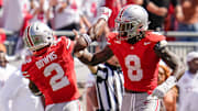 Ohio State Buckeyes safety Caleb Downs (2) and linebacker Arvell Reese (8) celebrate during the second half of the NCAA football game against the Texas Longhorns at Ohio Stadium on Aug. 30, 2025. Ohio State won 14-7.