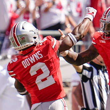 Ohio State Buckeyes safety Caleb Downs (2) and linebacker Arvell Reese (8) celebrate during the second half of the NCAA football game against the Texas Longhorns at Ohio Stadium on Aug. 30, 2025. Ohio State won 14-7.