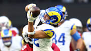 Dec 7, 2025; Glendale, Arizona, USA; Los Angeles Rams wide receiver Puka Nacua (12) makes a catch against the Arizona Cardinals during the first half at State Farm Stadium. Mandatory Credit: Mark J. Rebilas-Imagn Images
