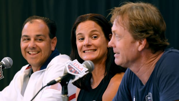 National Team Managing Director Lindsay Mintenko, center, speaks during a press conference in 2018.