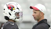 Arizona Cardinals quarterback Kyler Murray (1) talks with head coach Jonathan Gannon during training camp at State Farm Stadium in Glendale on Aug. 6, 2025.