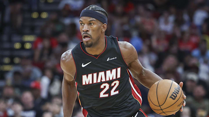 Apr 5, 2024; Houston, Texas, USA; Miami Heat forward Jimmy Butler (22) dribbles the ball during the third quarter against the Houston Rockets at Toyota Center. Mandatory Credit: Troy Taormina-Imagn Images