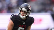 Atlanta Falcons wide receiver Drake London (5) looks on before the start of a play against the Carolina Panthers 