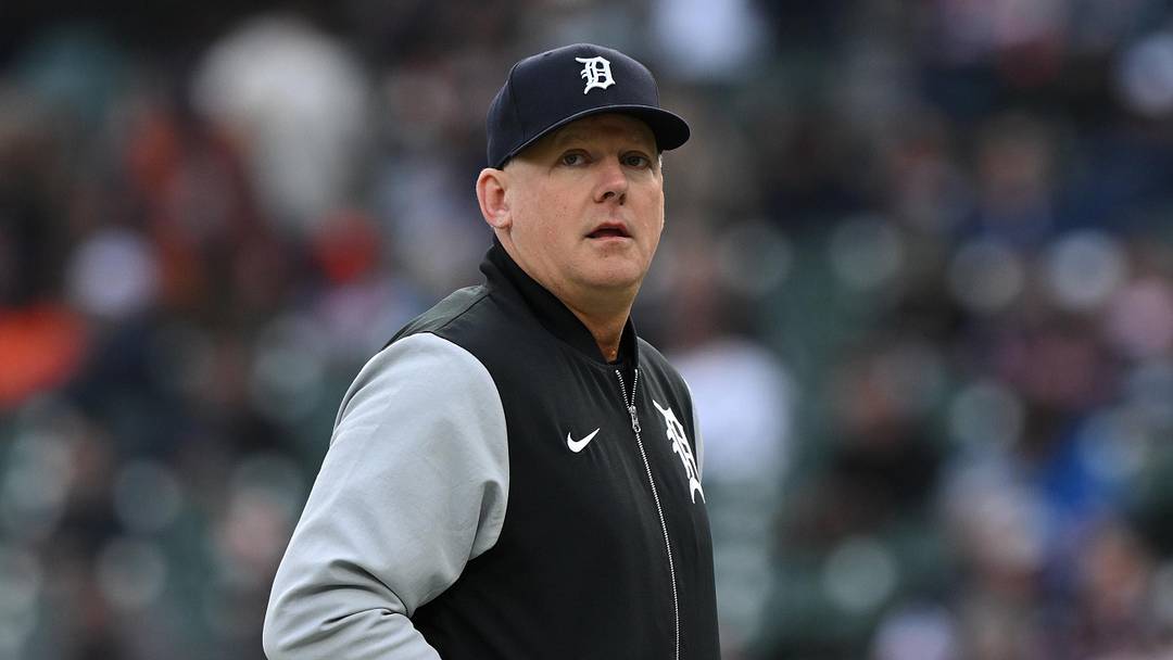 Tigers manager A.J. Hinch walks off the field after making a pitching change.