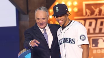 MLB Commissioner Rob Manfred takes a photo with Jurrangelo Cijntje after being drafted by the Seattle Mariners with the 15th pick during the first round of the MLB Draft at Cowtown Coliseum in 2024.