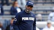 Penn State Nittany Lions interim head coach Terry Smith enters Kinnick Stadium before the game against the Iowa Hawkeyes.
