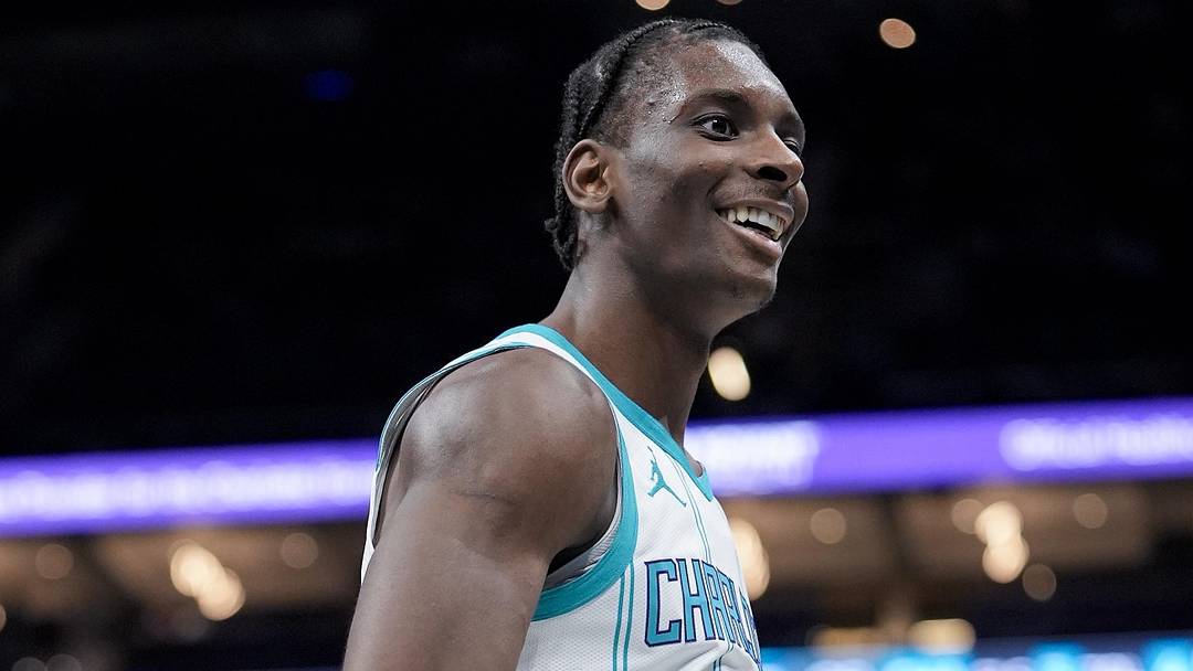 Mar 24, 2026; Charlotte, North Carolina, USA;  Charlotte Hornets forward Moussa Diabaté (14) reacts to chatter from Sacramento Kings guard Russell Westbrook (18) on the bench during the second half at Spectrum Center. Mandatory Credit: Jim Dedmon-Imagn Images