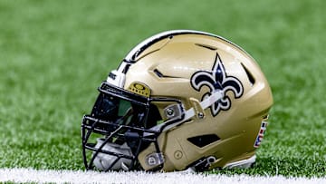 Jan 7, 2024; New Orleans, Louisiana, USA; Detailed view of the New Orleans Saints helmet during warmups against the Atlanta Falcons at Caesars Superdome. Mandatory Credit: Stephen Lew-Imagn Images