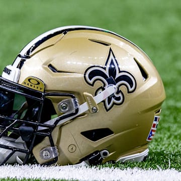 Jan 7, 2024; New Orleans, Louisiana, USA; Detailed view of the New Orleans Saints helmet during warmups against the Atlanta Falcons at Caesars Superdome. Mandatory Credit: Stephen Lew-Imagn Images