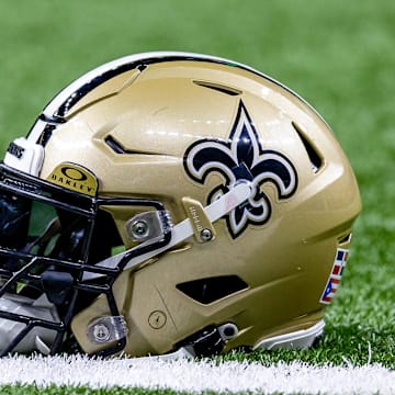 Jan 7, 2024; New Orleans, Louisiana, USA; Detailed view of the New Orleans Saints helmet during warmups against the Atlanta Falcons at Caesars Superdome. Mandatory Credit: Stephen Lew-Imagn Images