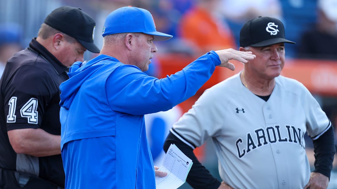 Florida head coach Kevin O'Sullivan meets with South Carolina head coach Paul Mainieri before an NCAA baseball game at Condron Ballpark in Gainesville, FL on Friday, March 13, 2026. [Alan Youngblood/Gainesville Sun]