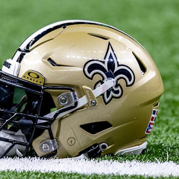 Jan 7, 2024; New Orleans, Louisiana, USA; Detailed view of the New Orleans Saints helmet during warmups against the Atlanta Falcons at Caesars Superdome. Mandatory Credit: Stephen Lew-Imagn Images
