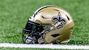 Jan 7, 2024; New Orleans, Louisiana, USA; Detailed view of the New Orleans Saints helmet during warmups against the Atlanta Falcons at Caesars Superdome. Mandatory Credit: Stephen Lew-Imagn Images