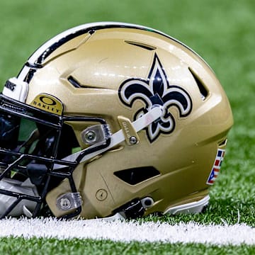 Jan 7, 2024; New Orleans, Louisiana, USA; Detailed view of the New Orleans Saints helmet during warmups against the Atlanta Falcons at Caesars Superdome. Mandatory Credit: Stephen Lew-Imagn Images