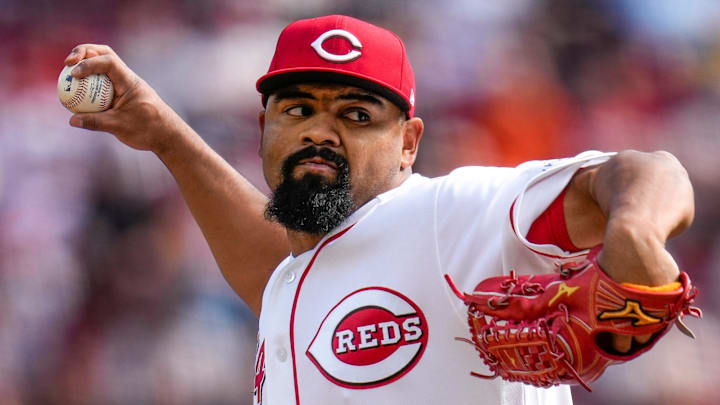 Cincinnati Reds pitcher Tony Santillan (64) throws a pitch