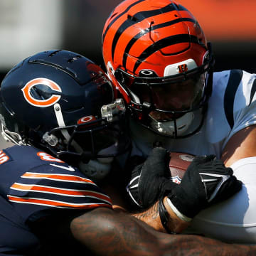 Bengals linebacker Logan Wilson is dragged down after an interception against the Bears. Cincinnati will reportedly rest starters in Saturday's preseason game at Soldier Field.