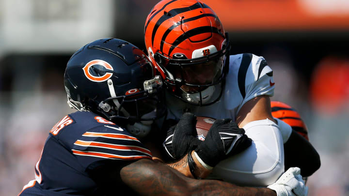 Bengals linebacker Logan Wilson is dragged down after an interception against the Bears. Cincinnati will reportedly rest starters in Saturday's preseason game at Soldier Field.