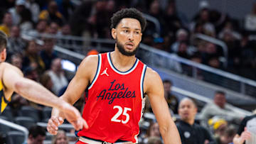 Feb 23, 2025; Indianapolis, Indiana, USA;  LA Clippers guard Ben Simmons (25) dribbles the ball while Indiana Pacers guard T.J. McConnell (9) defends in the first half at Gainbridge Fieldhouse. Mandatory Credit: Trevor Ruszkowski-Imagn Images