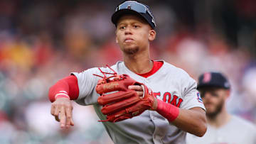 Boston Red Sox second baseman Kristian Campbell (28) throws a runner out at first against the Atlanta Braves in the eighth inning at Truist Park.