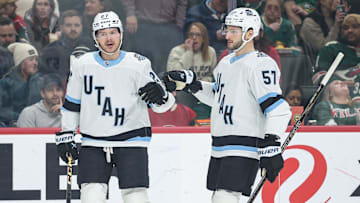 Jan 23, 2025; Saint Paul, Minnesota, USA; Utah Hockey Club center Barrett Hayton (27) celebrates his goal with teammates during the first period against the Minnesota Wild at Xcel Energy Center. 