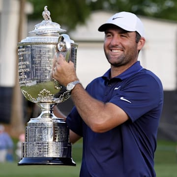 Scottie Scheffler holds the Wanamaker Trophy after winning the PGA Championship golf tournament at Quail Hollow.