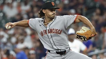 Mar 31, 2025; Houston, Texas, USA; San Francisco Giants starting pitcher Jordan Hicks (12) pitches against the Houston Astros in the first inning  at Daikin Park.