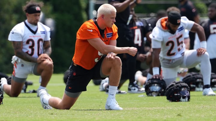 Jul 26, 2024; Cincinnati, OH, USA; Cincinnati Bengals quarterback Joe Burrow (9) stretches during training camp practice at Kettering Health Practice Fields. Mandatory Credit: Kareem Elgazzar-USA TODAY Sports