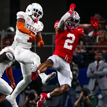 Ohio State receiver Emeka Egbuka (2) has a catch broken up by Texas Longhorns defensive back Jahdae Barron (7) during the College Football Playoff semifinal game in the Cotton Bowl at AT&T Stadium on Friday, Jan. 10, 2024 in Arlington, Texas.