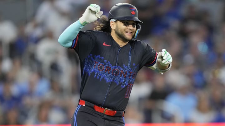 Jul 19, 2024; Toronto, Ontario, CAN; Toronto Blue Jays shortstop Bo Bichette (11) reacts as he suffers a lower body injury as he runs to first base during the sixth inning against the Detroit Tigers at Rogers Centre.