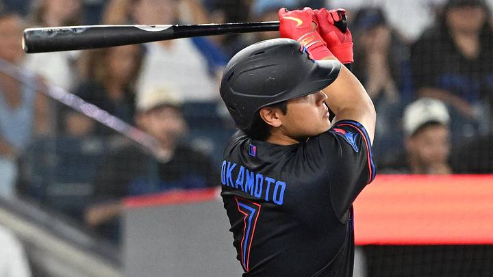 Jun 26, 2026; Toronto, Ontario, CAN;  Toronto Blue Jays third baseman Kazuma Okamoto (7) hits a two run home run against the Texas Rangers in the eighth inning at Rogers Centre. Mandatory Credit: Dan Hamilton-Imagn Images
