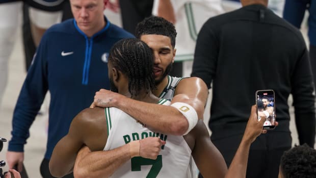 Jun 12, 2024; Dallas, Texas, USA; Boston Celtics forward Jayson Tatum (0) hugs guard Jaylen Brown (7) after the game between the Dallas Mavericks and the Boston Celtics in game three of the 2024 NBA Finals at American Airlines Center. Mandatory Credit: Jerome Miron-USA TODAY Sports