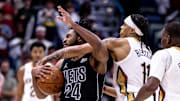 Nov 11, 2024; New Orleans, Louisiana, USA;  New Orleans Pelicans guard Brandon Boston Jr. (11) fouls Brooklyn Nets guard Cam Thomas (24) during the second half at Smoothie King Center. Mandatory Credit: Stephen Lew-Imagn Images