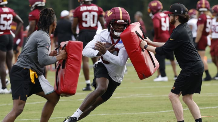 Jul 25, 2024; Ashburn, VA, USA; Washington Commanders wide receiver Marcus Rosemy-Jacksaint (83) carries the ball during day two of Commanders training camp at OrthoVirginia Training Center at Commanders Park. Mandatory Credit: Geoff Burke-USA TODAY Sports