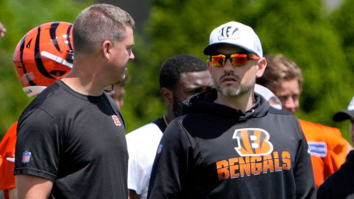 Bengals head coach Zach Taylor, left, and offensive coordinator Dan Pitcher watch their team during OTAs Tuesday, May 28, 2024 at the Kettering Health Practice Fields outside of Paycor Stadium.