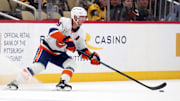 Dec 29, 2024; Pittsburgh, Pennsylvania, USA;  New York Islanders center Brock Nelson (29) moves the puck against the Pittsburgh Penguins during the third period at PPG Paints Arena. Mandatory Credit: Charles LeClaire-Imagn Images