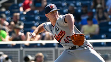 Jun 20, 2022; Omaha, NE, USA;  Auburn Tigers pitcher Blake Burkhalter (40) pitches against the Stanford Cardinal in the ninth inning at Charles Schwab Field. Mandatory Credit: Steven Branscombe-Imagn Images