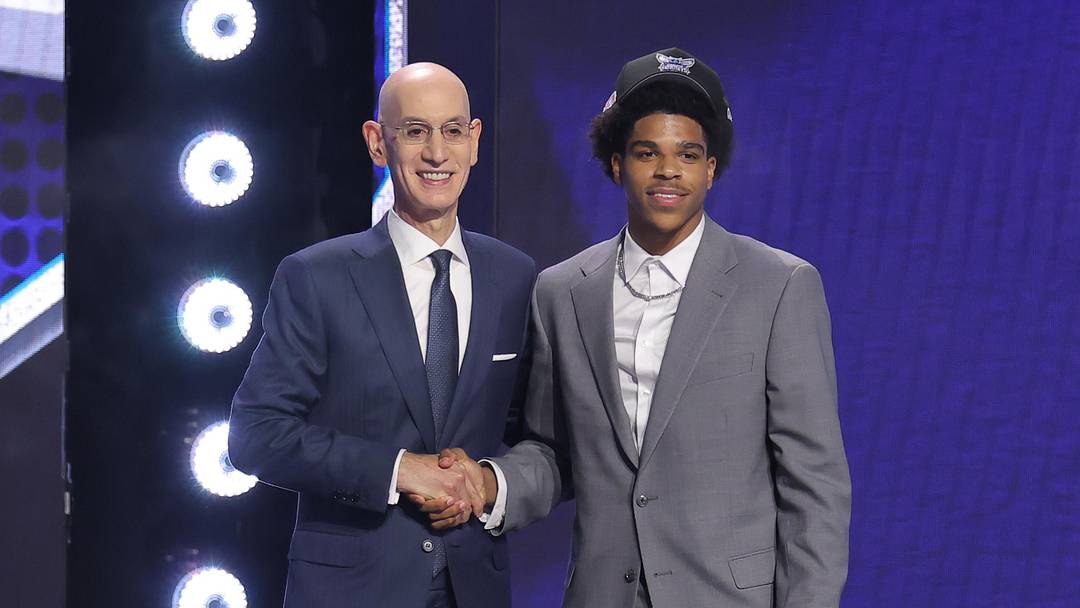 Jun 23, 2026; New York, NY, USA; NBA commissioner Adam Silver greets the eighteenth pick in the 2026 NBA draft, Texas Tech guard Christian Anderson Jr. after he was selected by the Charlotte Hornets at Barclays Center. Mandatory Credit: Brad Penner-Imagn Images