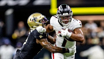 Nov 10, 2024; New Orleans, Louisiana, USA;   Atlanta Falcons running back Bijan Robinson (7) makes a first down against New Orleans Saints cornerback Will Harris (5) during the second half at Caesars Superdome. Mandatory Credit: Stephen Lew-Imagn Images