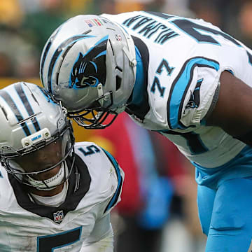 Carolina Panthers running back Rico Dowdle (5) and offensive tackle Yosh Nijman (77) celebrate after Dowdle runs for a first down to set up a game-winning field goal against the Green Bay Packers on Sunday, November 2, 2025, at Lambeau Field in Green Bay, Wis. The Panthers won the game, 16-13, on a 49-yard field goal as time expired.
Tork Mason/USA TODAY NETWORK-Wisconsin