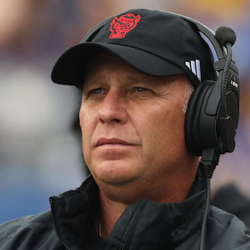 Oct 25, 2025; Pittsburgh, Pennsylvania, USA;  North Carolina State Wolfpack head coach Dave Doeren looks on from the sidelines against the Pittsburgh Panthers during the first quarter at Acrisure Stadium. Mandatory Credit: Charles LeClaire-Imagn Images