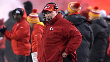 Jan 16, 2022; Kansas City, Missouri, USA; Kansas City Chiefs head coach Andy Reid (front) looks on from the sideline during the first quarter against the Pittsburgh Steelers in an AFC Wild Card playoff football game at GEHA Field at Arrowhead Stadium. Mandatory Credit: Denny Medley-Imagn Images
